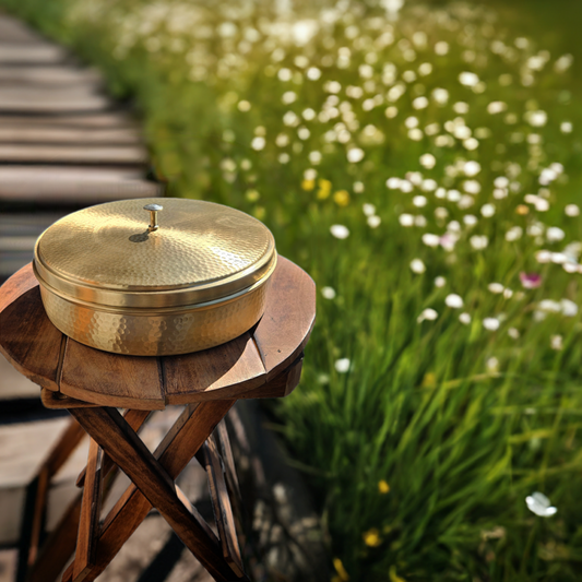 Hammered Masala box kept on wooden garden table