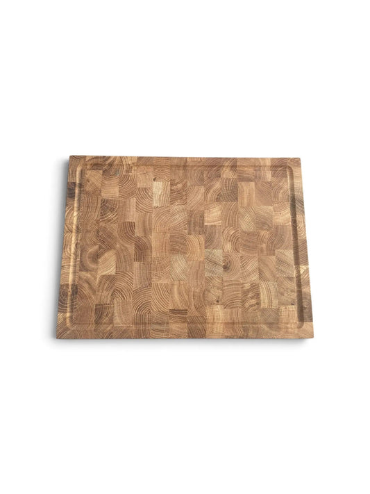 A square wooden cutting board with a mixed-grain butternwood pattern, featuring a raised rim, shown on a plain white background.