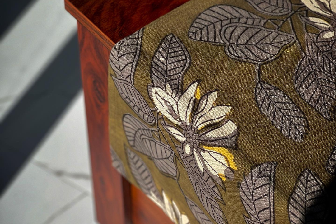 Pond of Corbett table runner in forest green, featuring floral and leaves design, handcrafted from natural colours. Perfect for rustic and nature-inspired home design. Dimensions: 33cm width, 214cm length.