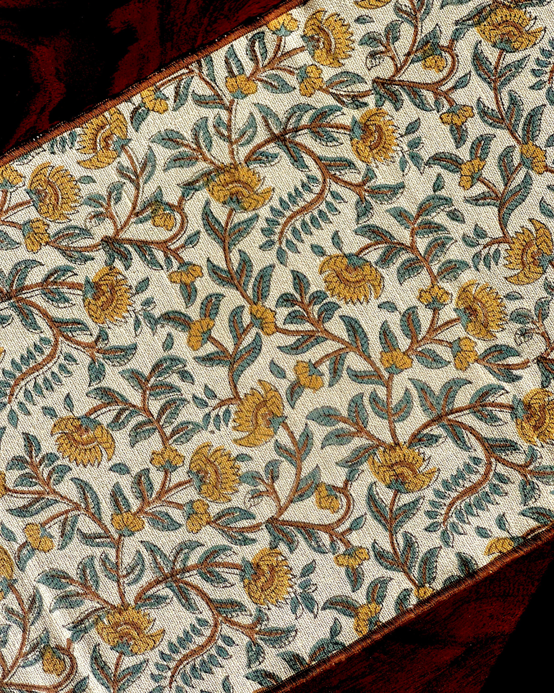 Balmer table runner with yellow flowered pattern and embroidered boundaries, made of cotton, handmade.