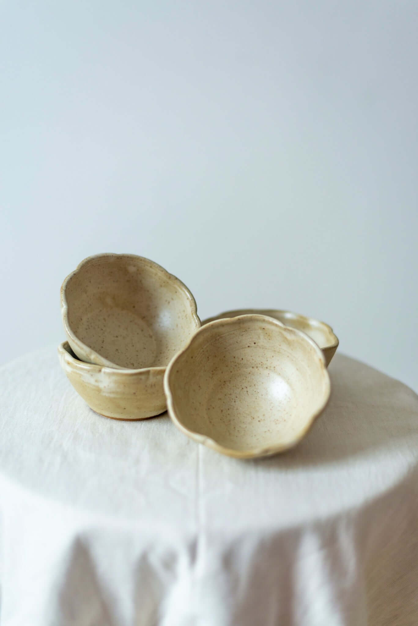 Handcrafted rusty white ceramic dessert bowl with a smooth glazed finish, ideal for serving desserts and snacks