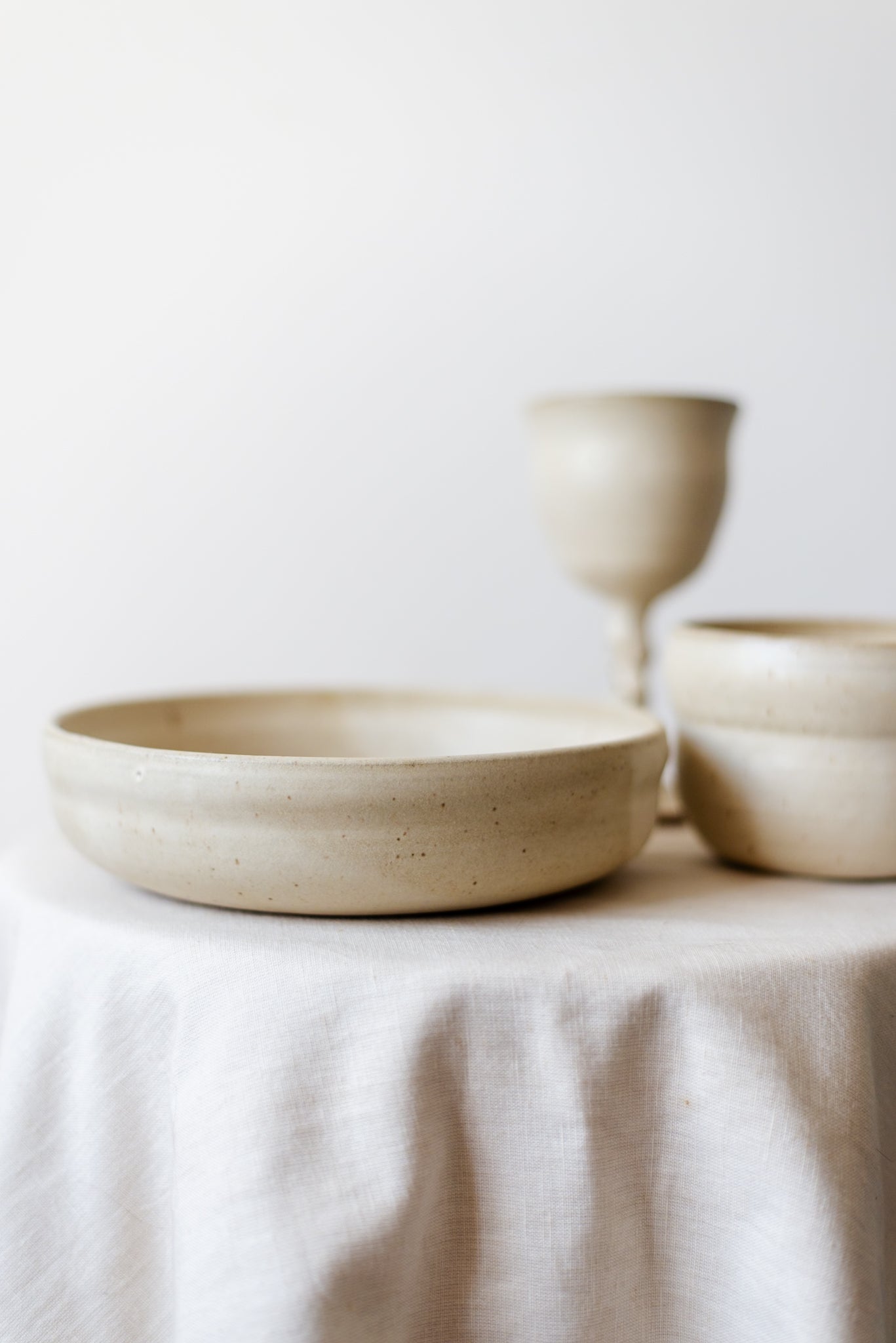 Handcrafted wide ceramic bowl with a smooth finish, ideal for serving salads, fruits, or soups.