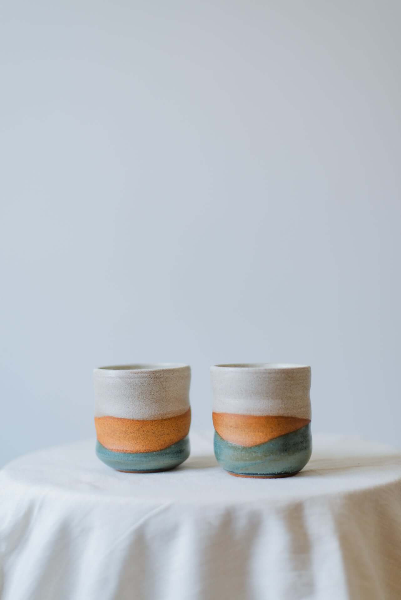 Handcrafted Yunomi ceramic cup with a smooth finish, perfect for tea or hot beverages.