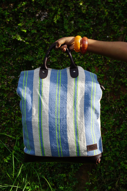 The Striped Forager Bag in Sky Blue, a handwoven tote inspired by the Bengali bajaar bag.